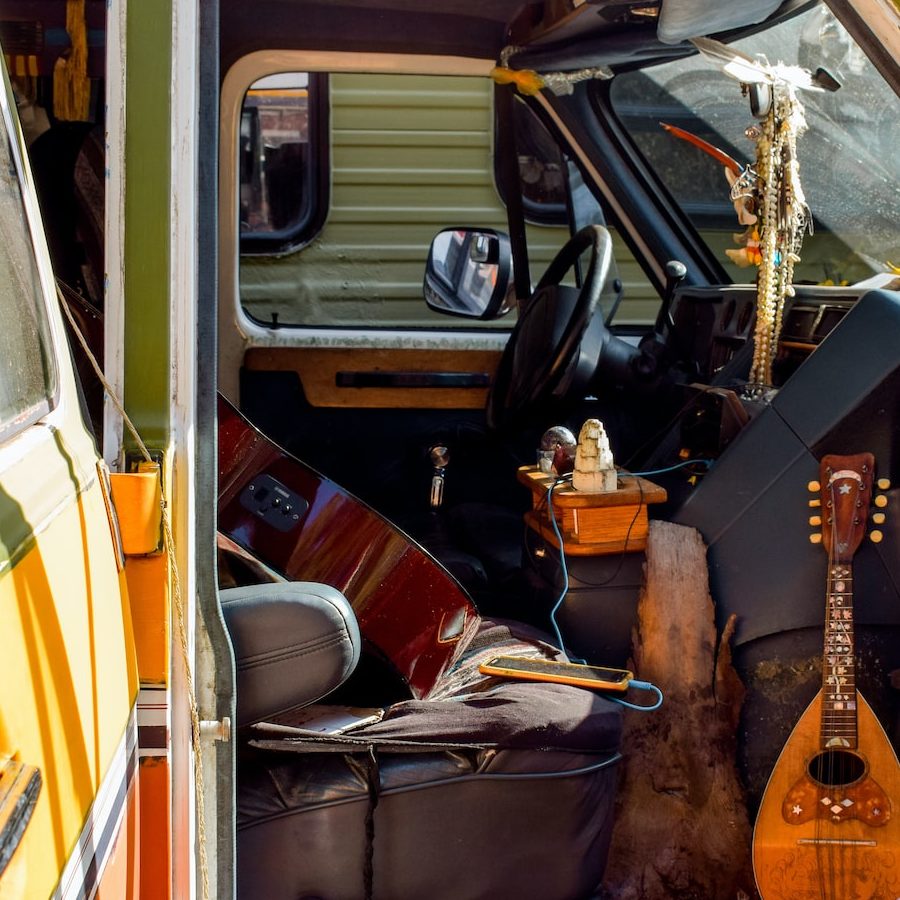 Photo by Sarah Brown brown acoustic guitar on black car